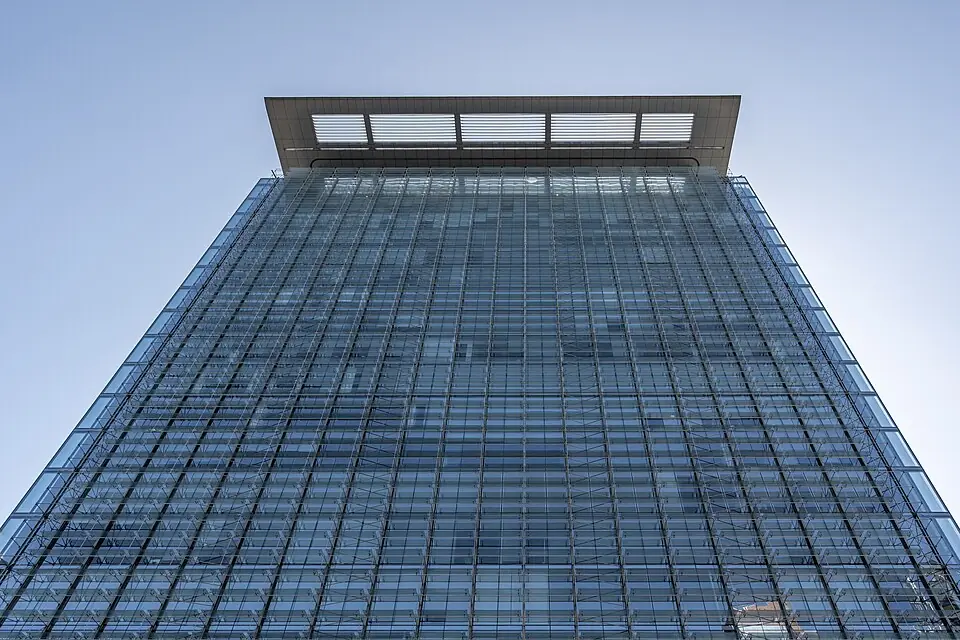 Modern office building exterior viewed from below